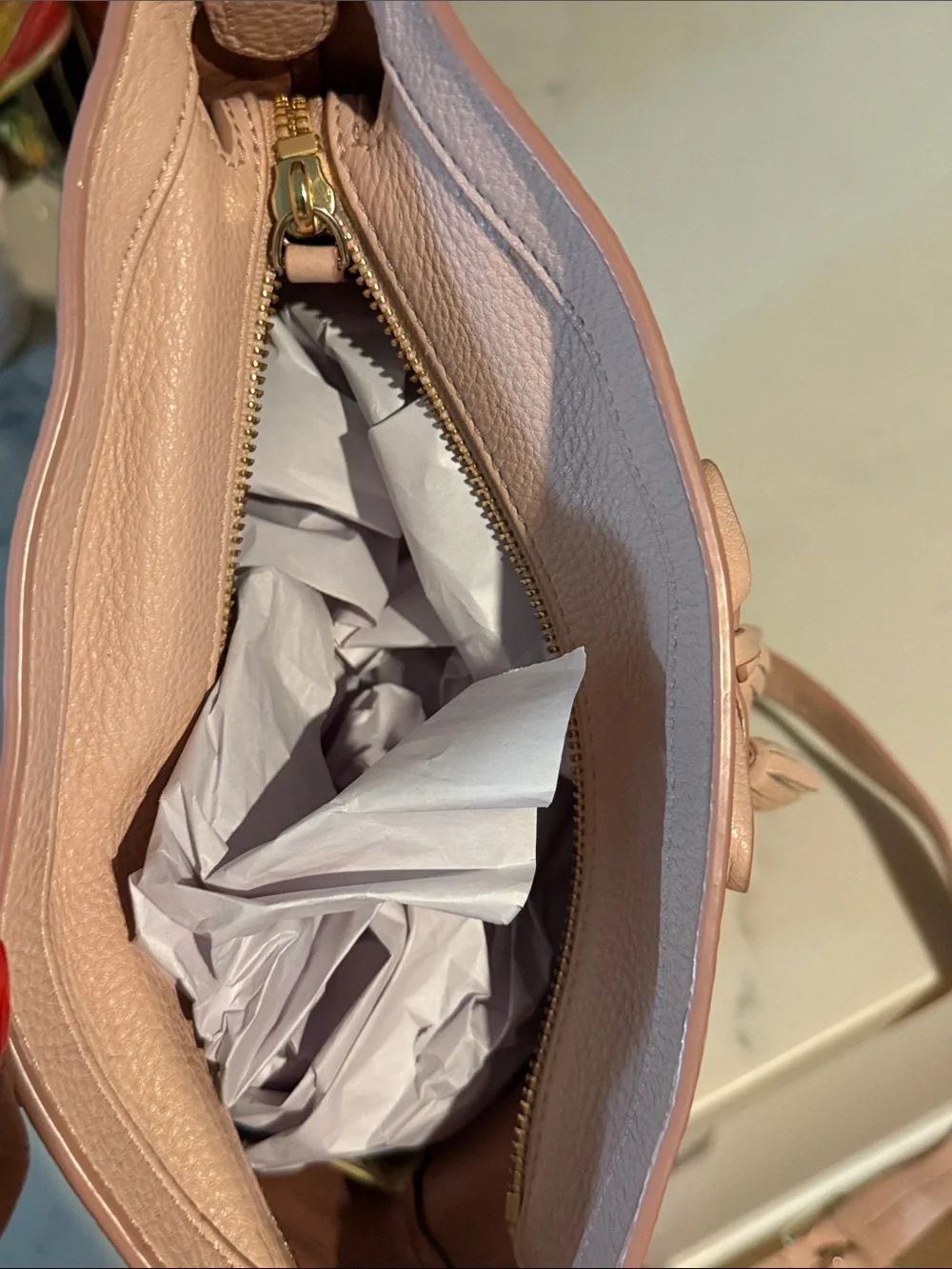 kate spade Pebbled Leather Tassel Crossbody Bag in Pale Pink